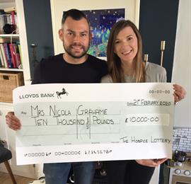 Rollover Winner receives cheque