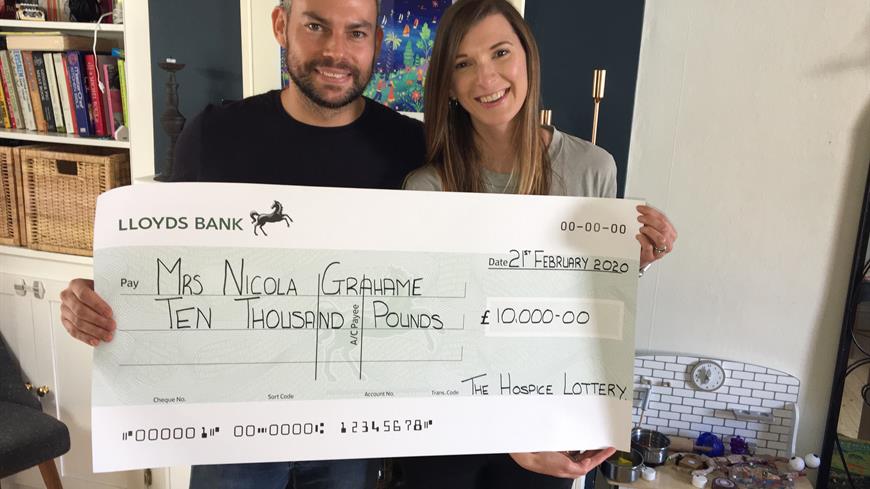 Rollover winner receiving the £10,000 prize